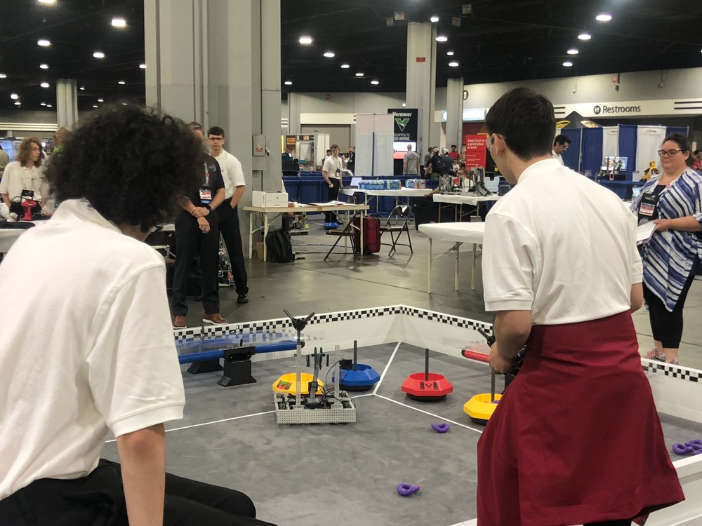 Boys using a robot